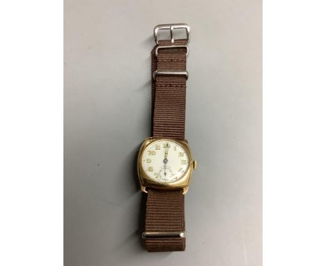   A gentleman's 1940's 9ct gold Longines manual wind wrist watch, with case back inscription, on associated fabric strap,case