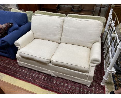 A Wesley Barrell cream fabric metal action two seater sofa bed, width 160cm, depth 96cm, height 82cm