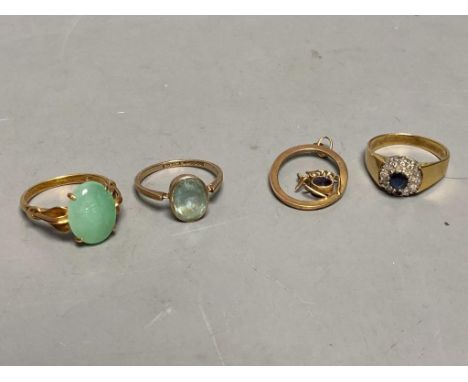   A yellow metal (stamped 14k) and green cabochon set ring, size N, gross 3.7 grams, a 9ct ring and spider pendant, gross 2.7