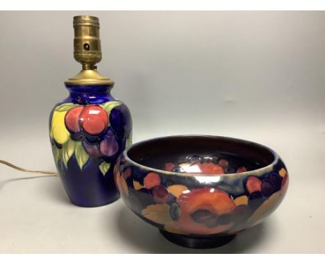   A small Moorcroft wisteria pattern table lamp base, height 16.5cm not including light fitting, and a Moorcroft Pomegranate 