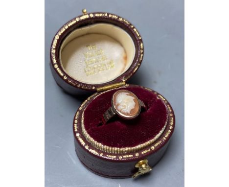   A yellow metal and oval cameo shell set child's ring,size D, gross 1.4 grams.