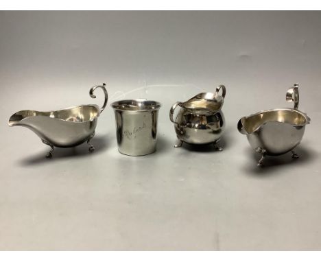   A Britannia silver Christening mug, Sheffield 1931, a pair of silver cream boats, Birmingham 1909 and a small silver sugar 