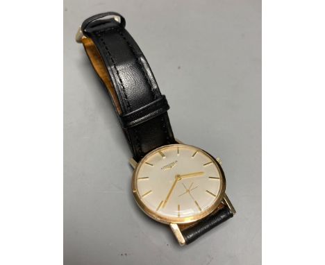   A gentleman's 1960's 9ct gold Longines manual wind wrist watch, on associated leather strap, case diameter ex. crown, 33mm,