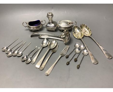   A three-piece silver condiment of oval half-reeded form, two silver sifter spoons, a pair of silver berry spoons and sundry
