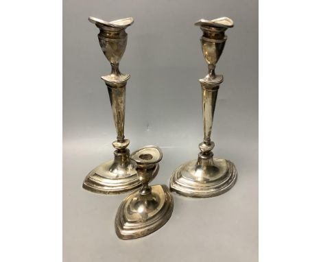   A pair of Mappin &amp; Webb George III style silver candlesticks and a similar dwarf candlestick,all of oval form with tape