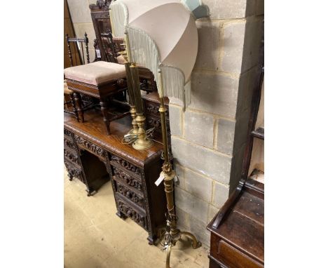  An adjustable gilt standard lamp and a pair of corinthian column lamps