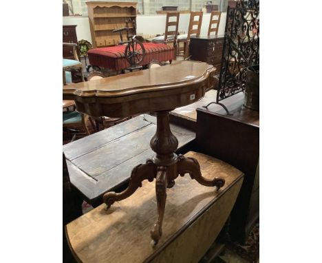   A Victorian figured walnut serpentine folding card table, width 90cm, depth 45cm, height 76cm