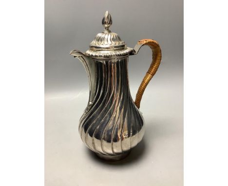   A George III silver hot water jug of wrythen baluster form,London 1766, possibly by Trevillion Taylor, height 25.1cm, gross
