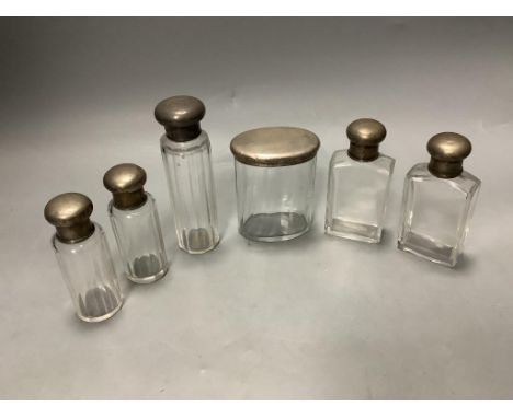   Six assorted silver mounted glass toilet jars, tallest 13.9cm.