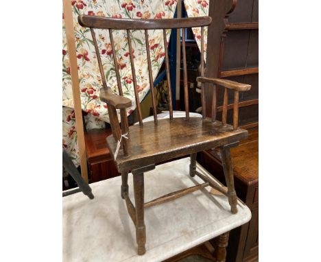   An early 19th century, possibly Welsh ash and fruitwood primitive Windsor comb back elbow chair, width 59cm, depth 40cm, he