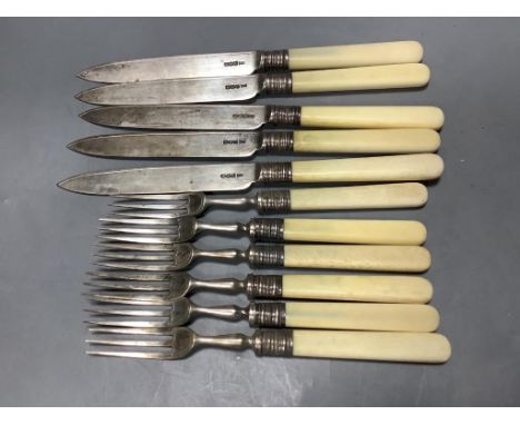   Five pairs of George V ivory handled silver dessert eaters and one other fork, Walker &amp; Hall, Sheffield, 1919.