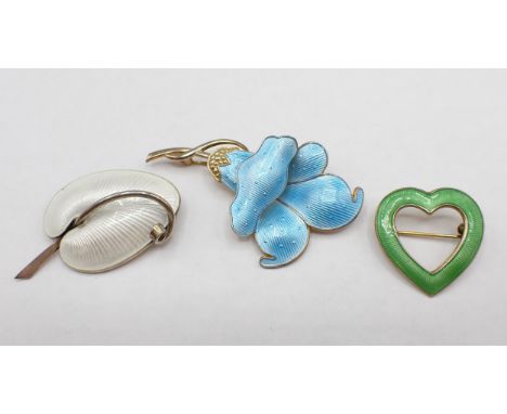 A Danish silver and white enamel Lily Leaf Brooch, a silver and blue enamel Flower Brooch 38mm wide and green heart 30mm wide