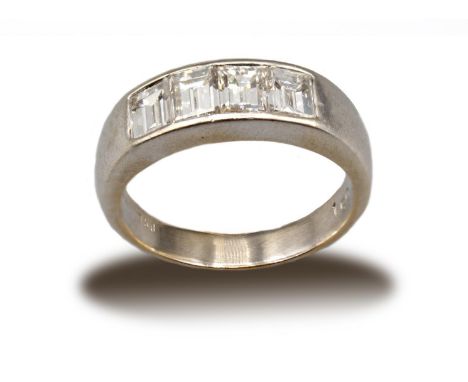 A Diamond four stone Ring channel-set graduated step-cut stones, estimated total diamond weight, 0.90cts, in white gold stamp