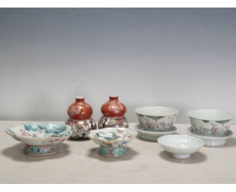 Two Chinese Republican period Bowls and Stands and a similar pedestal Saucer, each decorated numerous figures in a landscape 