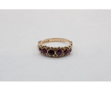 A vintage Garnet Ring set six round stones in 9ct gold, ring size L 