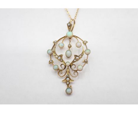 An early 20th Century Opal and Seed Pearl Pendant the openwork plaque millegrain-set round opals and graduated seed pearls, s