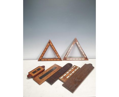 Two inlaid triangular Cribbage Boards with compartments for pegs (one with pegs), a Honduras mahogany Cribbage Board, possibl