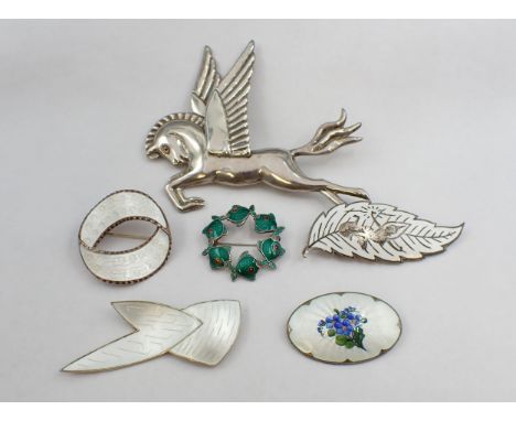 Three Norwegian silver and enamel Brooches in white, a Danish silver and enamel 'circle of frogs' Brooch stamped VB, a Thai s