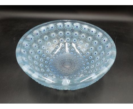 A Lalique glass Bowl 'Nemours Thousand Eyes' pattern, 10in diam, moulded mark R. LALIQUE, France.There is no damage  