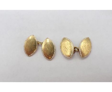 A pair of 18ct gold shield shaped Cufflinks with white enamel borders engraved monogram, DSE, approx 15.3gms 