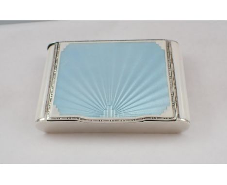 An Art Deco silver and enamel Compact the lid with duck egg blue fan design on white ground, lipstick holder to one end, Birm