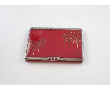 A 1920's Continental silver and red enamel Cigarette Case with starburst design to lid, maker; PNV?, approx 20in x 3in.Import