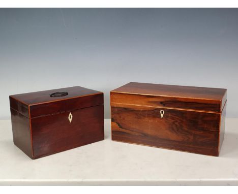 A Regency mahogany Tea Caddy with boxwood stringing, having oval metal handle, the interior with covered compartment and spac
