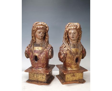 A pair of 18th Century Spanish lime wood Reliquaries, carved in the form of female figures with naturalistically painted face