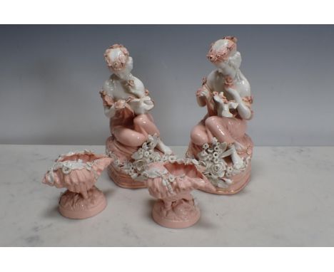 A pair of Continental Figures of ladies with dove, floral encrusted decoration in pink and white and a small pair of shell Bo