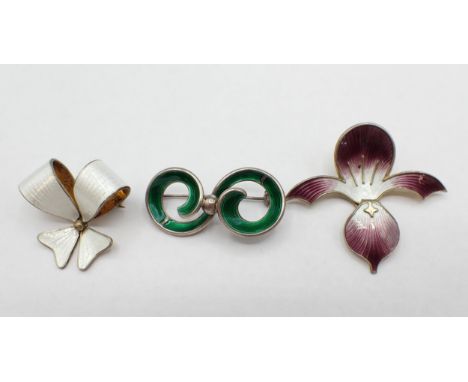 Three Norwegian silver and enamel Modernist Brooches; white bow 35mm wide, green scroll, 43mm wide and purple and white trefo