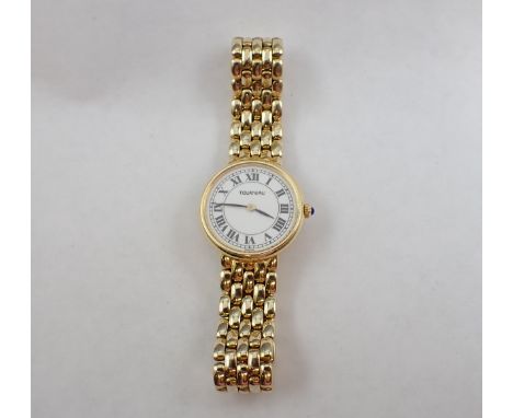 A lady's Tourneau quartz Wristwatch the white enamel dial with black roman numerals in 14ct gold case with lapis lazuli caboc