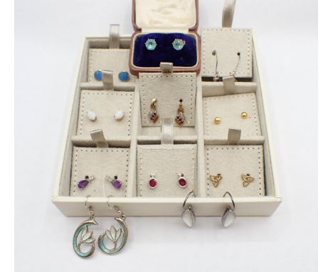 A collection of mostly modern Ear Studs set various stones including amethyst, rubies and opals, three pairs of drop Earrings
