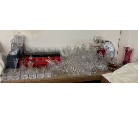 A set of four Spode Christmas tree wine glasses together with a large collection of crystal drinking glasses, vases, candlest