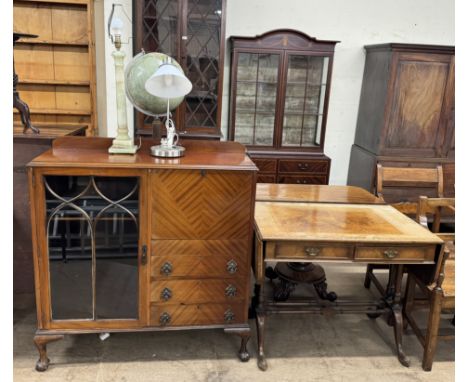A 20th century mahogany bureau display cabinet with a glazed door, drop down writing surface and drawers on cabriole legs and