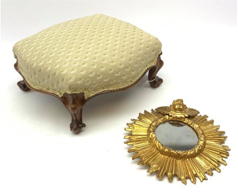 An early 20th century sunburst mirror, detailed with the head and wings of a cherub, approximate D24cm, together with a Victo