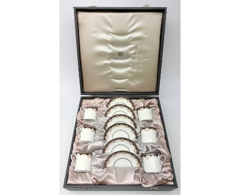 A cased Wedgwood coffee set for six, comprising six coffee cans and six saucers, decorated in the Medici pattern.  - Conditio