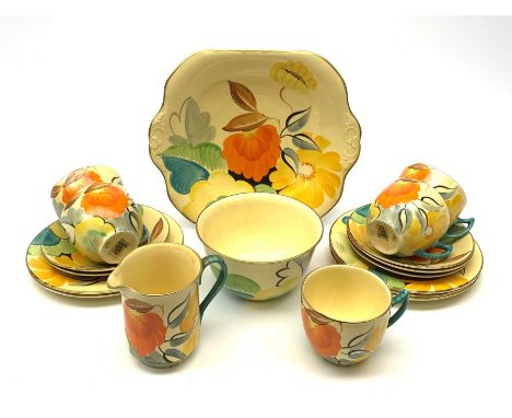 A Grays Pottery tea set, hand painted with flowers in tones of orange, yellow and green, comprising five tea cups and five sa