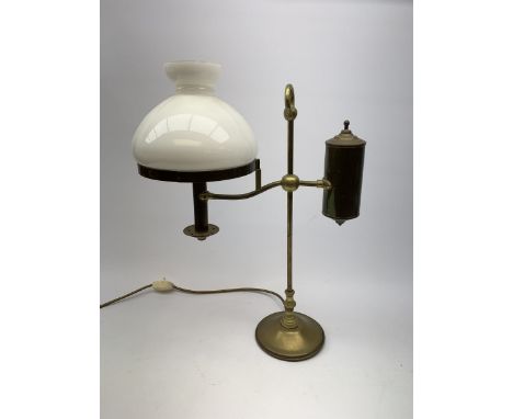 A brass students lamp, with adjustable arm supporting counter weight and white glass shade, H49cm.  - Condition Report 