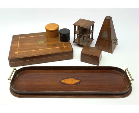 An Edwardian mahogany tray with twin brass handles and inlaid shell detail to centre, L54.5cm, a miniature revolving table to