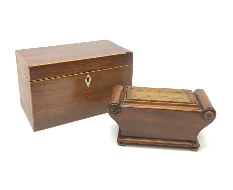 An early 19th century Regency style mahogany trinket box, of sarcophagus form with scroll ends and raised upon compressed bun