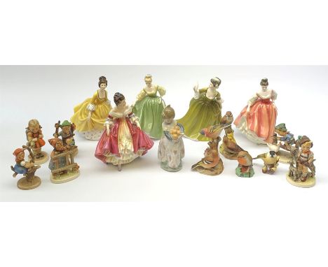 A group of figurines, comprising five Royal Doulton examples, Southern Belle HN2229, Simone HN2378, Coralie HN2307, Fair Lady