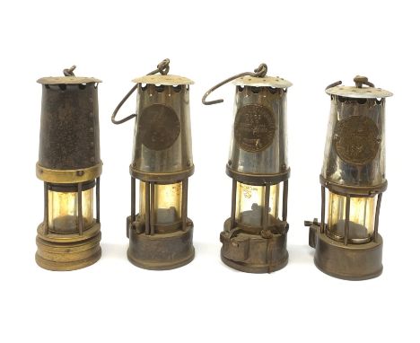 Two miners lamps, by Protector Lamp &amp; Lighting, Eccles, together with two further unmarked examples. (4).  - Condition Re