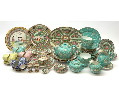 A Chinese tea set, comprising seven tea cups, eight saucers, eight side plates, sandwich plate, teapot, milk jug, cream jug, 