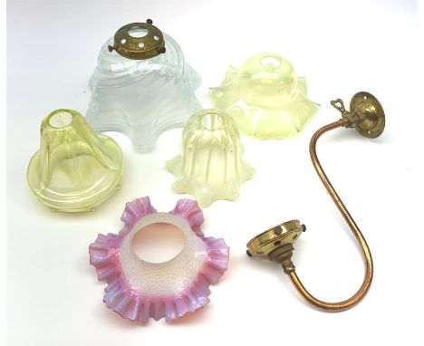 A group of four Vaseline glass light shades, largest D22.5cm, together with another glass shade, and a wall fitting.  - Condi