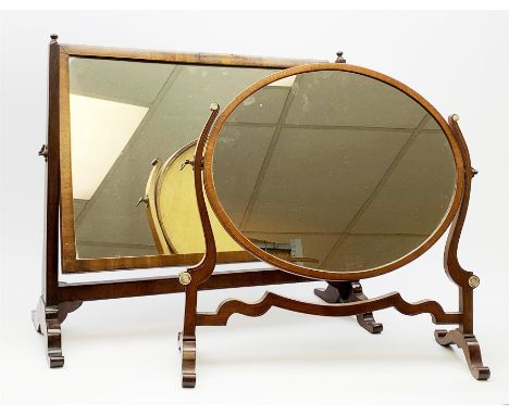 An Edwardian mahogany dressing table mirror, the oval mirror plate in swing frame, upon flared legs linked by stretcher, the 