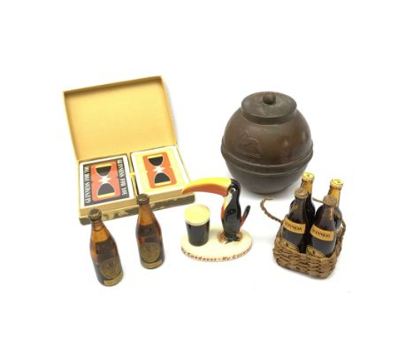 A group of Guinness related items, comprising Carltonware toucan, H9cm, six miniature Guinness bottles, four in wicker carry 