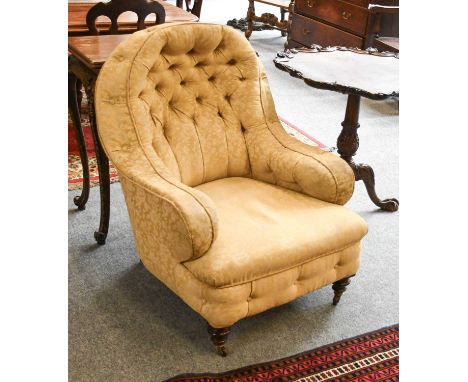 Cornelius V Smith: A Victorian Walnut-Framed Button-Back Armchair, late 19th century, recovered in yellow and floral damask, 
