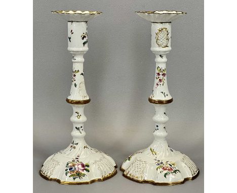 PAIR OF LATE 18TH CENTURY STAFFORDSHIRE ENAMEL CANDLESTICKS, painted in polychrome enamels with floral sprays on a white grou