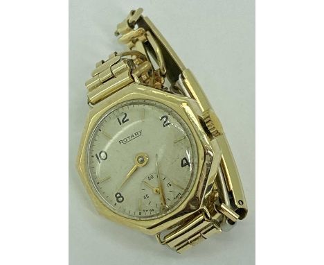 LADY'S ROTARY 9CT GOLD CASED WRISTWATCH - on a rolled gold bracelet, octagonal case, the dial set with Arabic evens and baton