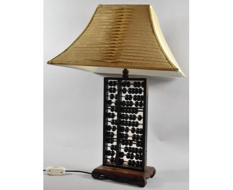 A Novelty Table Lamp Formed From a Chinese Abacus on Plinth Base and Scrolled Feet, 37cm high 